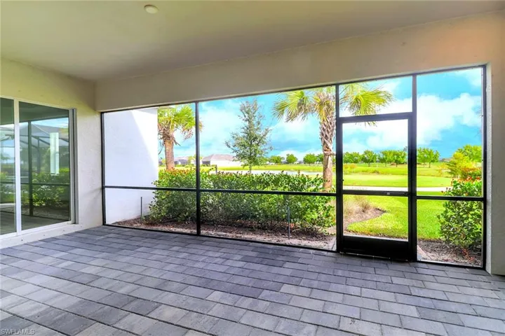 Unfurnished sunroom with view of golf course