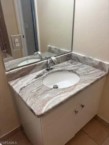 Bathroom featuring vanity and tile patterned flooring