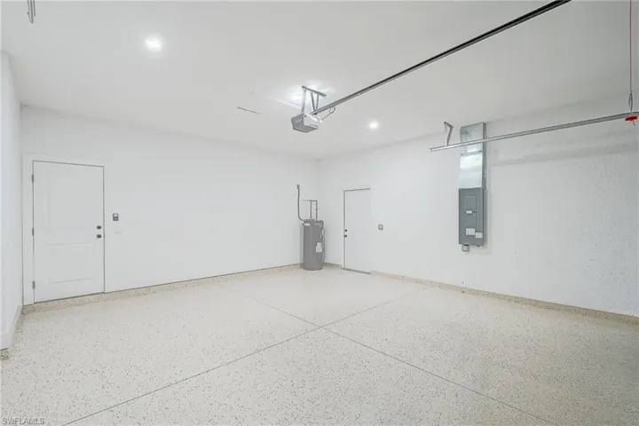 Garage with electric panel and water heater