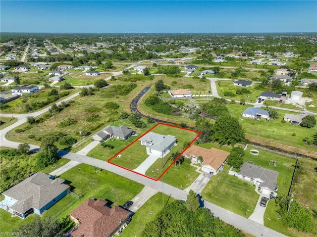 Aerial perspective of suburban area with property parcel outlined