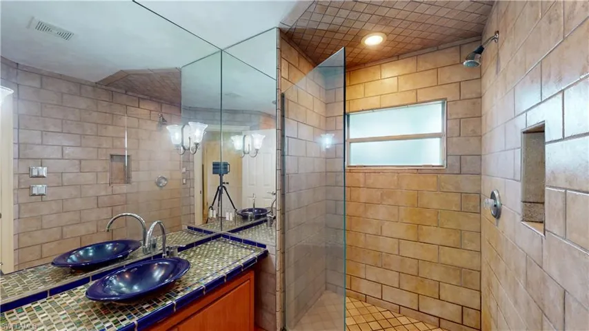 Bathroom with vanity and walk in shower