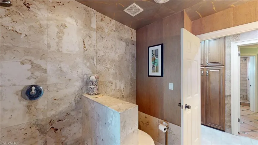 Full bath featuring tiled shower