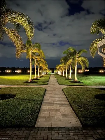 View of home's community with a yard