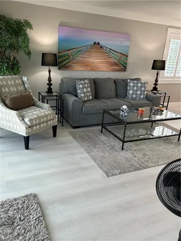 Living room featuring ornamental molding