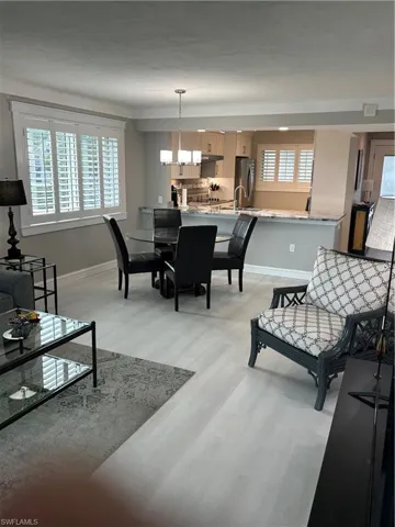 Dining space featuring light hardwood / wood-style flooring and a notable chandelier