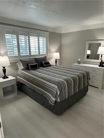 Bedroom featuring crown molding