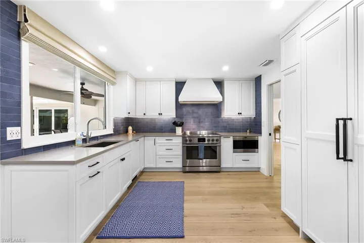 Kitchen featuring top of the line appliances and quartz countertops