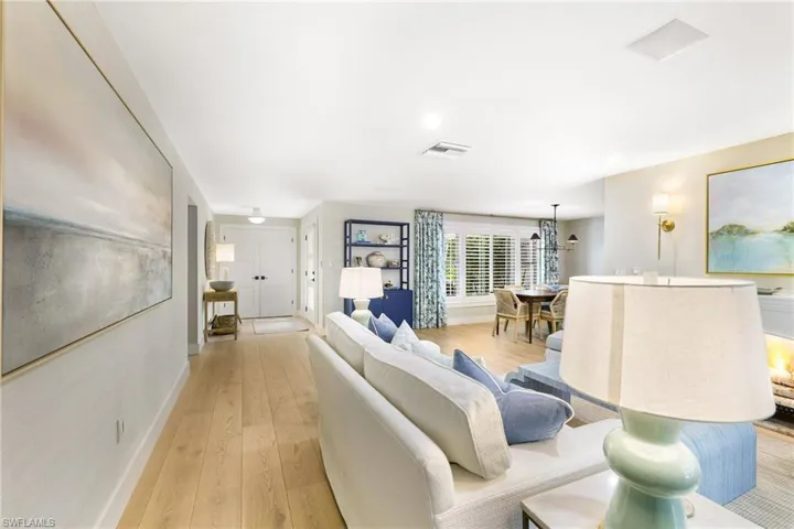 Living room featuring white oak hardwood floors throughout the home