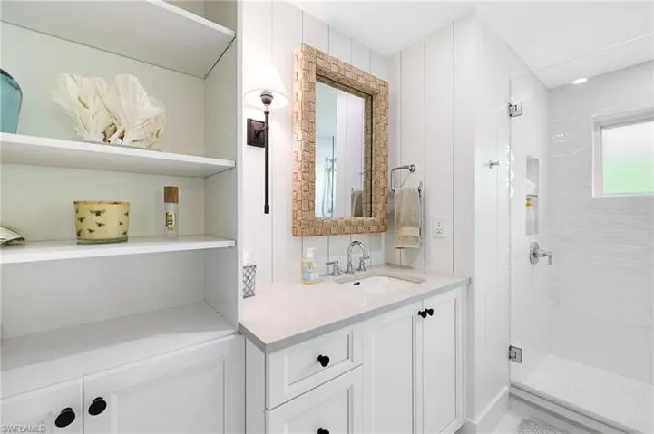 Nicely appointed third bathroom with tiled shower