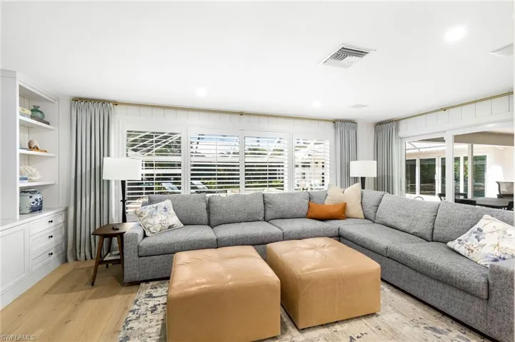 Family room with views to outdoor living and pool area
