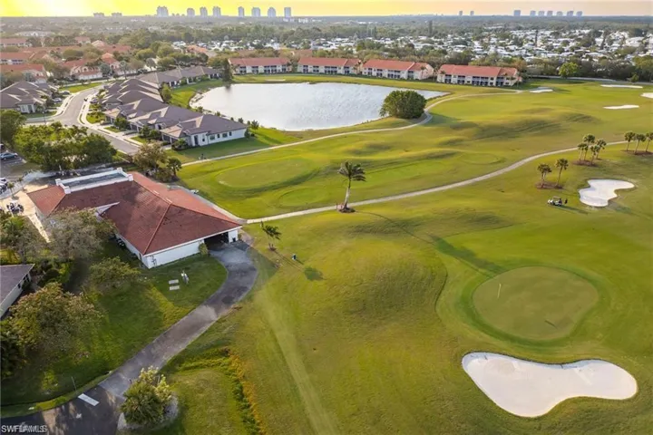 Expansive golf course greens featuring multiple sand traps and putting greens