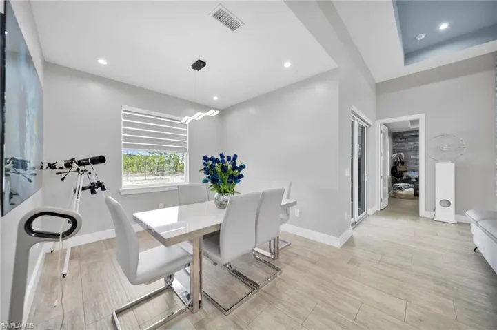 Dining area featuring recessed lighting and light wood-type flooring