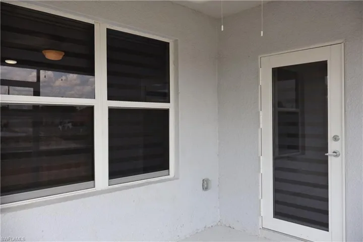 Empty room featuring dark wood-style floors and recessed lighting