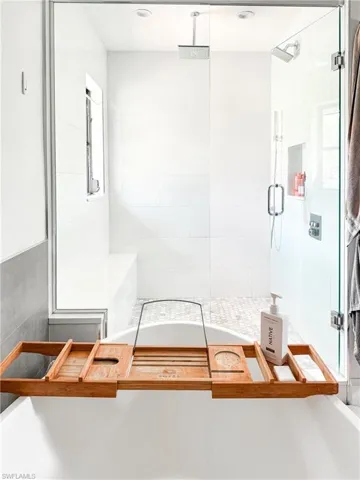 Bathroom featuring a shower with door