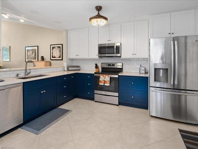 New stainless appliances (2021) tile floor on the diagonal, new cabinets, granite counters & garbage disposal in this dream kitchen.