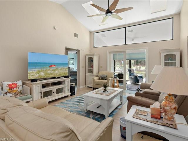 New French doors (Aug. 2023) lead out to the glass enclosed and screened lanai.