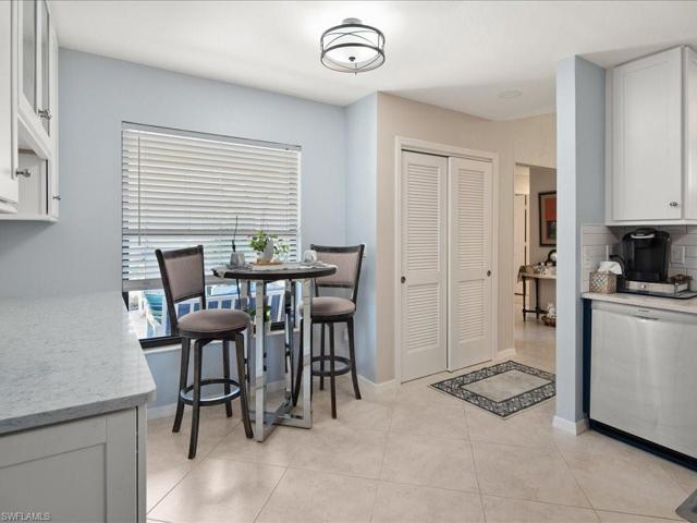 The cozy breakfast nook overlooks the courtyard.  Large window lets in natural light. Full-sized pantry to the right.