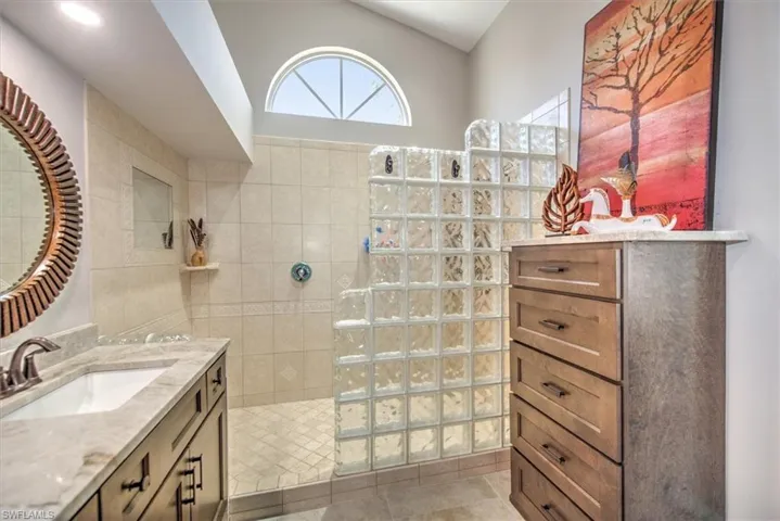 Full bathroom with vanity and walk in shower