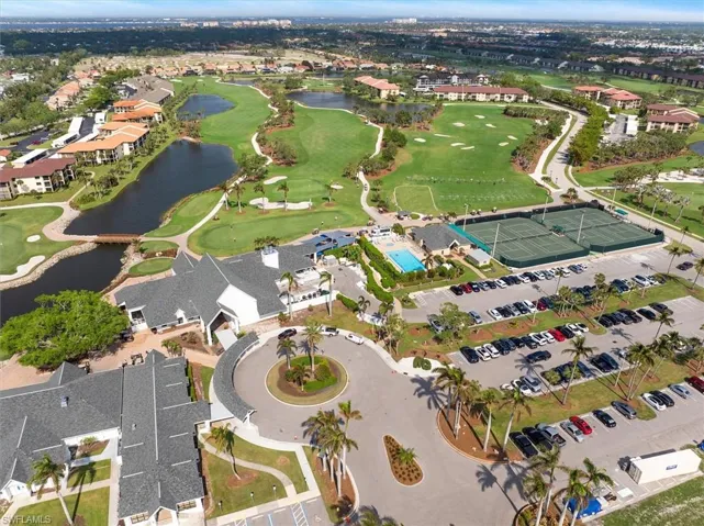 Aerial view featuring view of golf course and a water view