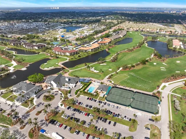 Aerial view featuring a residential view, a water view, and view of golf course