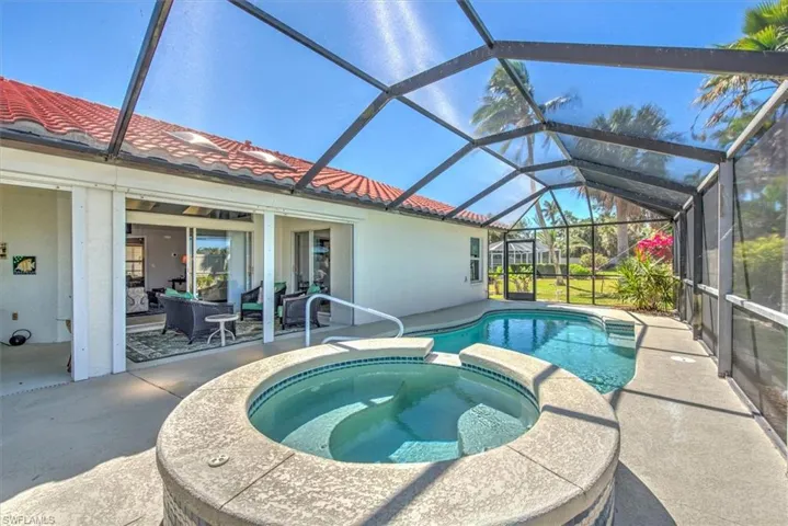 View of pool with outdoor lounge area, a lanai, a patio area, and a pool with connected hot tub
