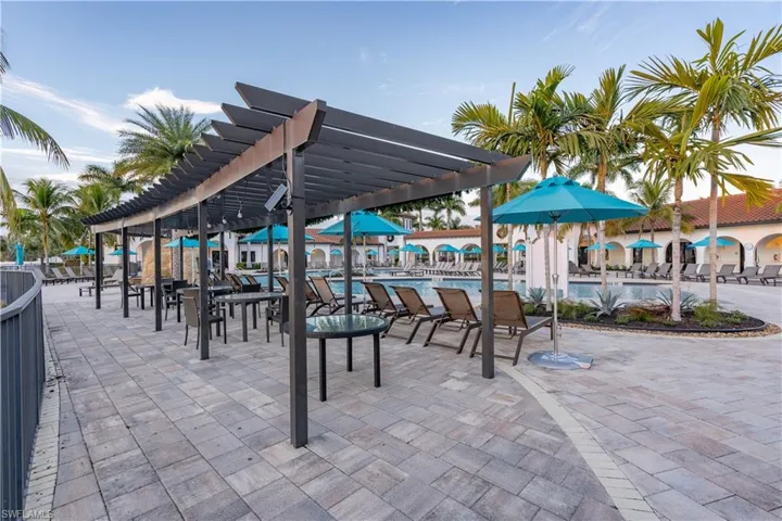 View of patio / terrace with a pergola and a community pool