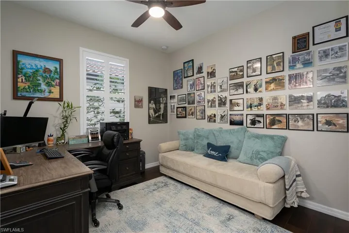 Office featuring wood-type flooring and ceiling fan
