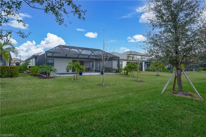 View of yard with a lanai
