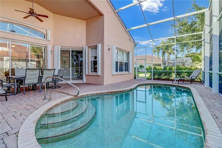 View of pool featuring a patio, a lanai, and ceiling fan