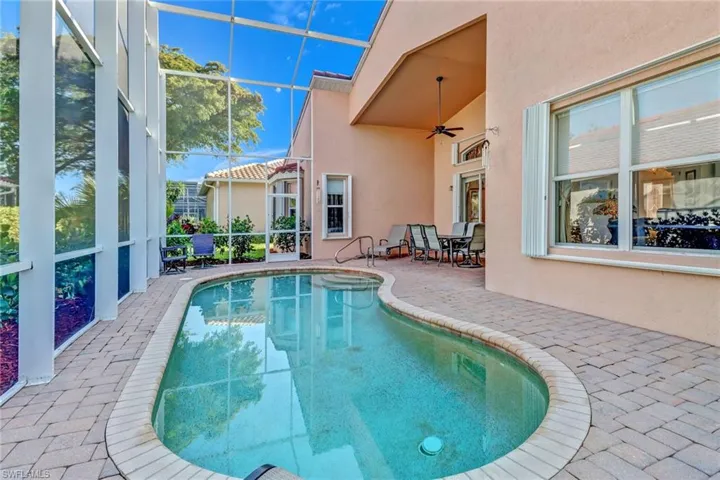 View of swimming pool featuring a patio and ceiling fan