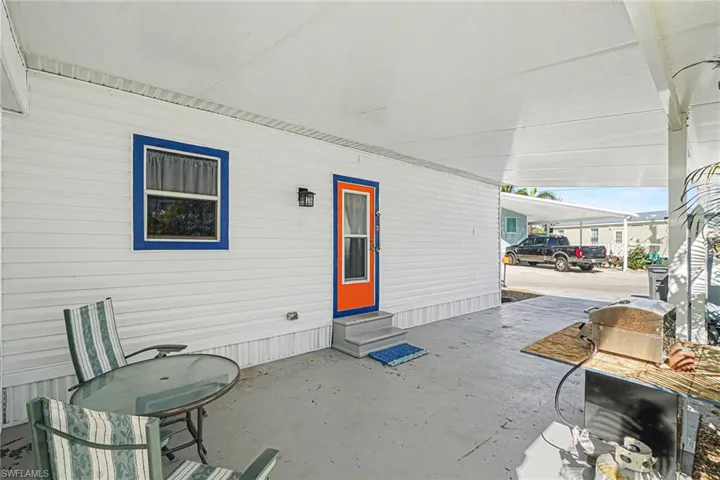 Covered porch featuring entry steps