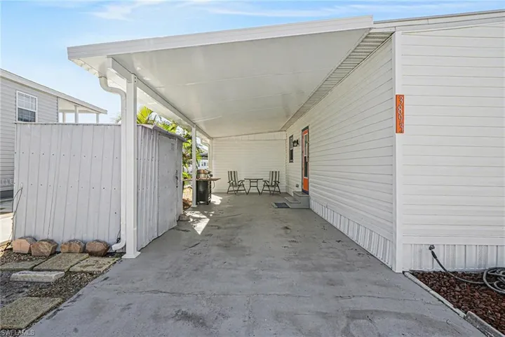 View of car parking featuring a new carport