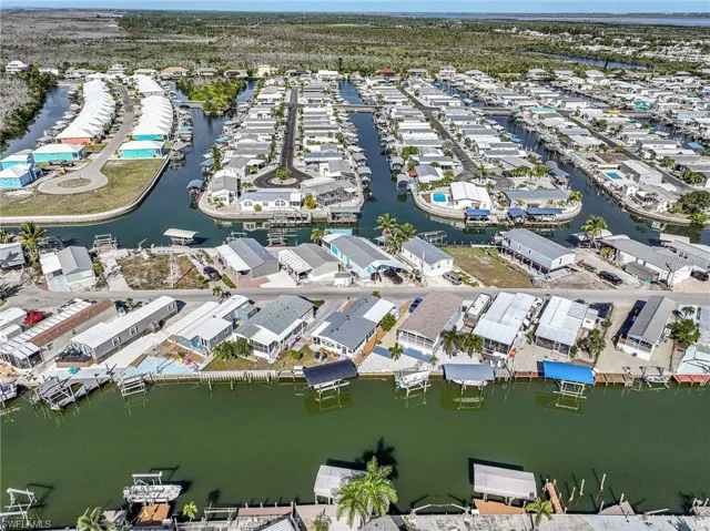 Aerial view of property's location featuring a large body of water