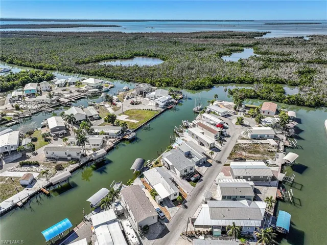 Aerial overview of property's location featuring a large body of water