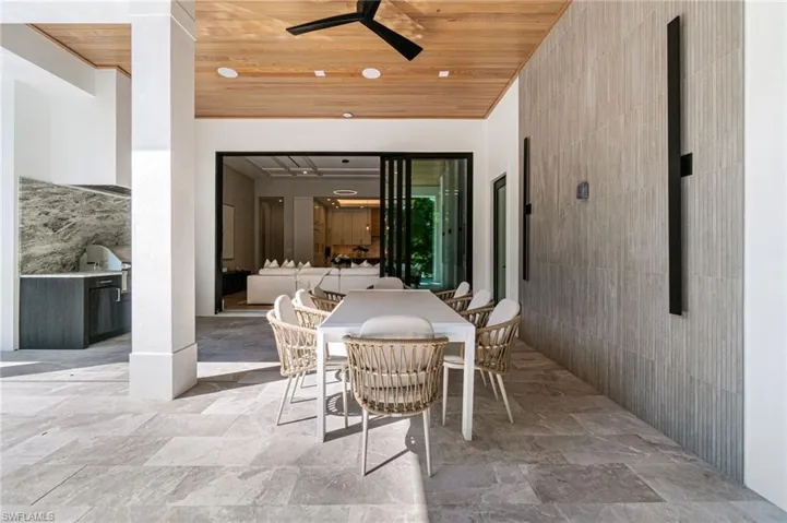 View of patio / terrace with area for grilling and ceiling fan