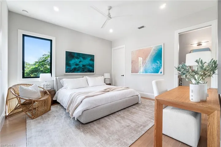 Bedroom with hardwood / wood-style flooring and ceiling fan
