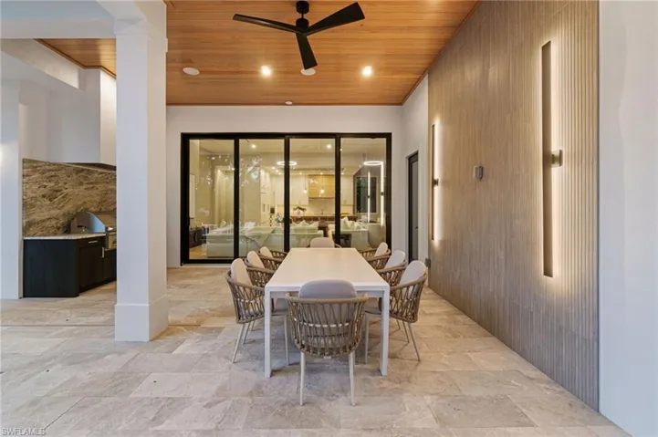 View of patio featuring ceiling fan and grilling area