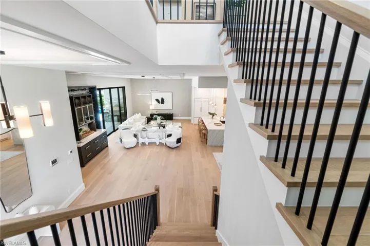 Stairs with hardwood / wood-style flooring