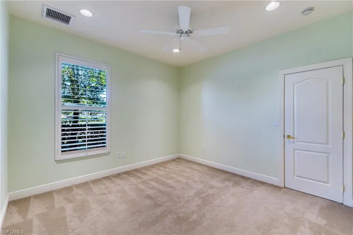 Spare room with light carpet, recessed lighting, and a ceiling fan