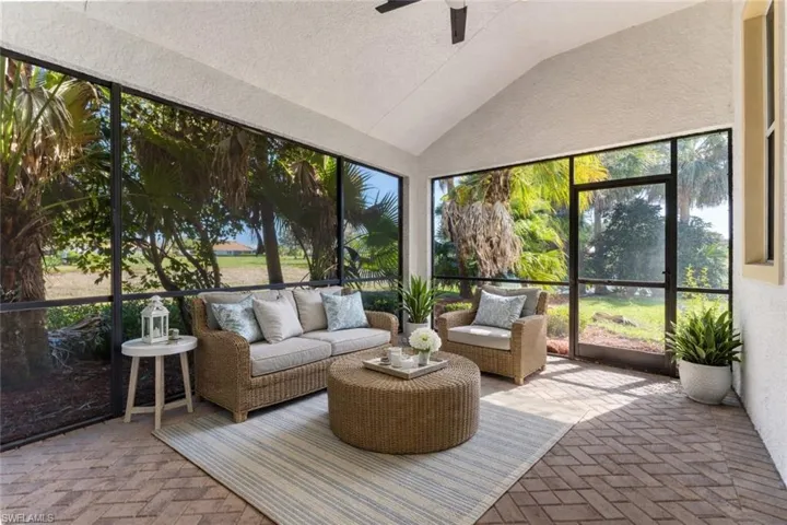 Staged Sunroom featuring lofted ceiling, an outdoor hangout area, and ceiling fan