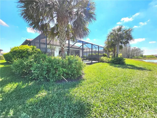 View of yard with a lanai