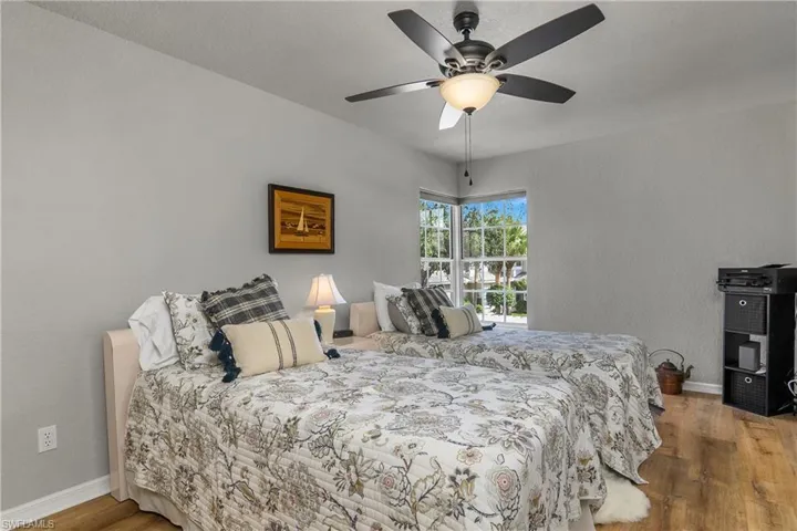 Bedroom featuring light wood-style flooring and ceiling fan