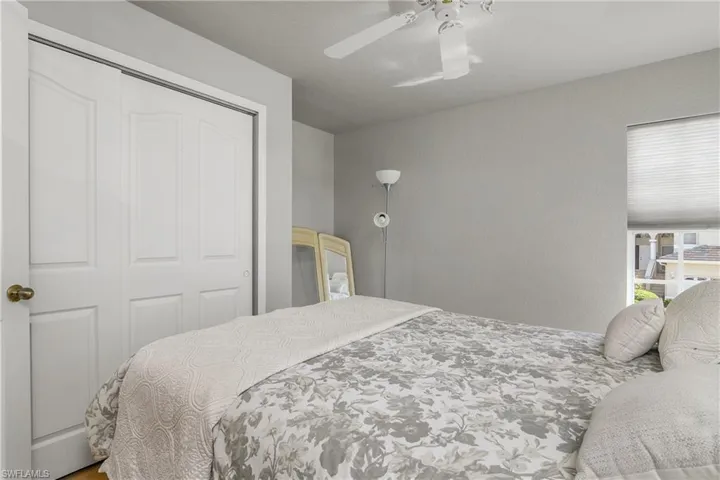 Bedroom featuring a closet and a ceiling fan