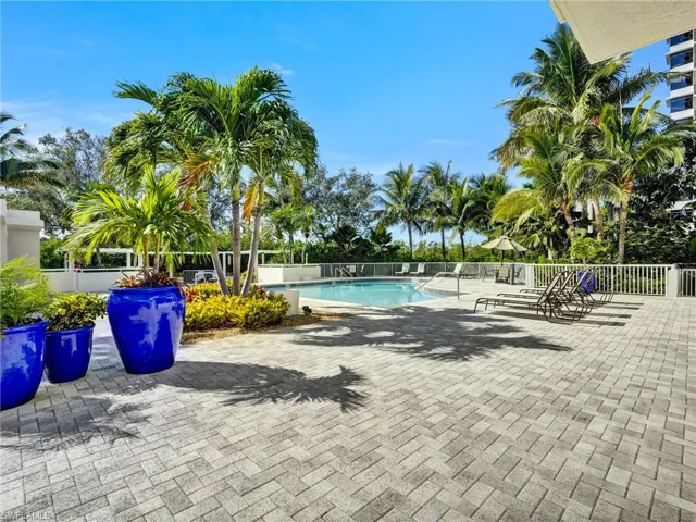 Community pool featuring a patio