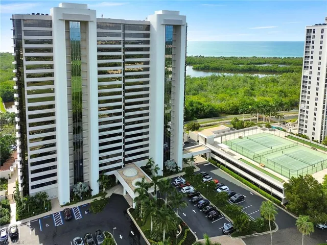 Bird's eye view complex with gulf, mangroves and parking garage