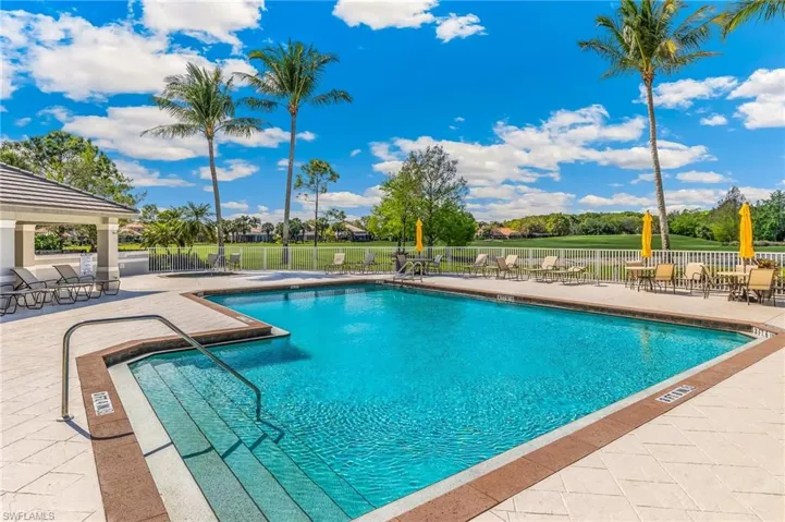 Community pool featuring a patio