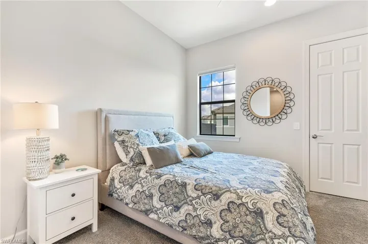 Bedroom with light carpet