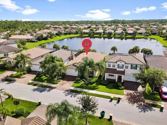 Aerial perspective of suburban area with a large body of water