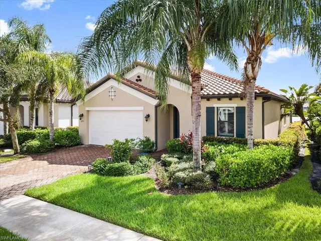 Mediterranean / spanish-style home featuring stucco siding, an attached garage, decorative driveway, and a tile roof