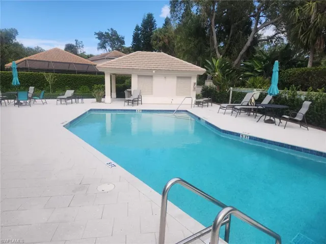 Community pool featuring a patio area